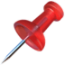 Glossy red pushpin with translucent head and silver needle